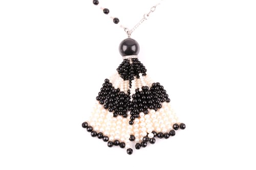 Lot 40 - An onyx and pearl sautoir necklace in the Art...