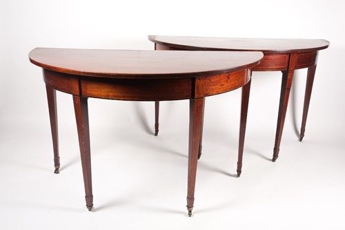 Lot 178 - A pair of George III mahogany demi-lune side...