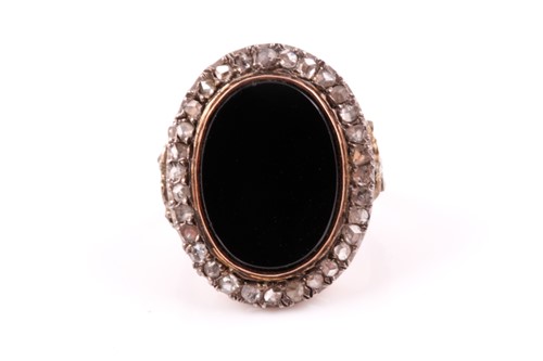 Lot 317 - A Victorian style yellow metal ring, set with...