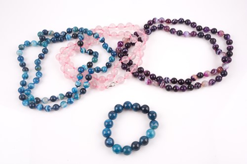 Lot 29 - A rose quartz long beaded necklace, with pink...