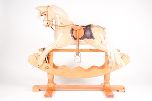 Lot 63 - A laminated pine rocking horse, by Ian...