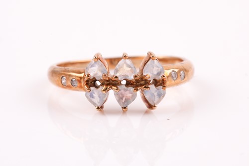 Lot 271 - A six stone half hoop moonstone ring, the...