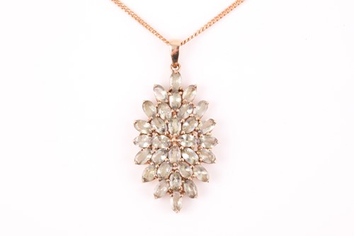Lot 285 - A 9ct yellow gold and green tanzanite pendant,...