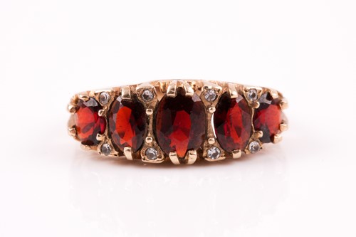 Lot 387 - A 9ct gold ring set with five mixed cut...