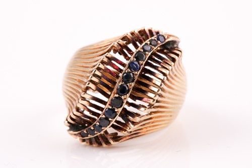 Lot 306 - A 14ct yellow gold and sapphire ring, set with...