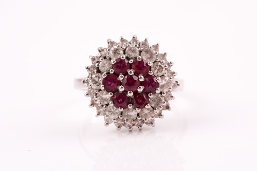 Lot 219 - A white metal diamond and ruby cluster ring,...