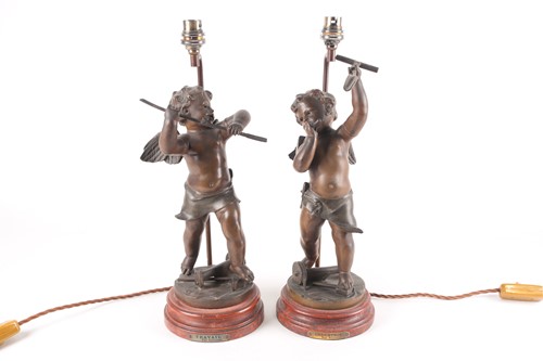 Lot 191 - A pair of patinated spelter figural table...