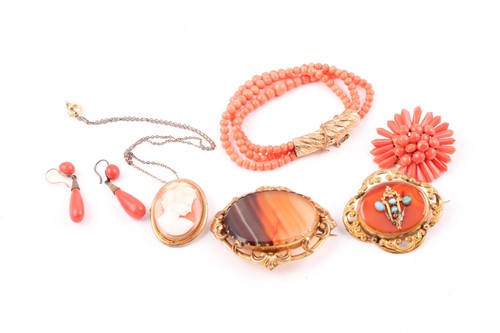 Lot 176 - A gilt metal and coral beaded bracelet, with...