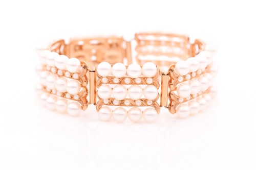 Lot 198 - A yellow metal and pearl bracelet, comprised...