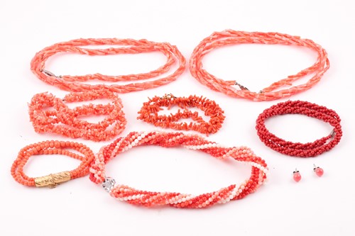 Lot 114 - A gilt metal and triple strand coral bracelet,...
