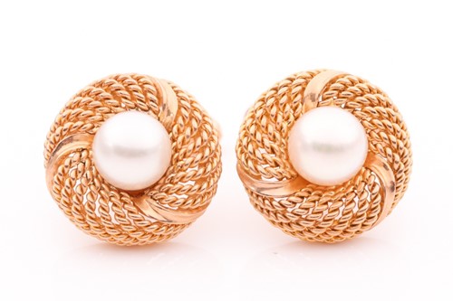 Lot 162 - A pair of yellow metal and pearl cufflinks,...