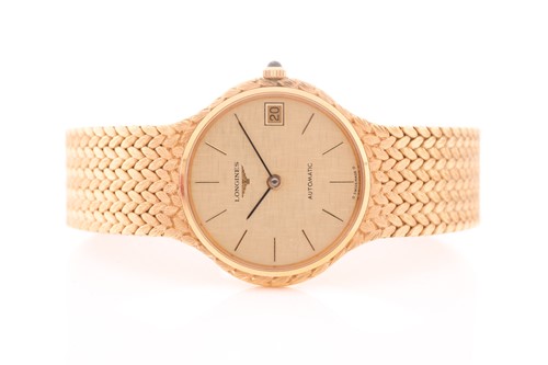 Lot 529 - A Longines 18ct yellow gold automatic dress...