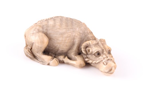 Lot 145 - A Japanese carved ivory netsuke in the form of...