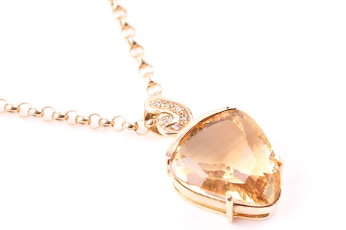 Lot 208 - A yellow metal and citrine pendant, set with a...