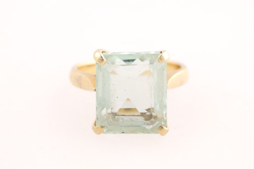 Lot 121 - A single stone aquamarine dress ring, the...