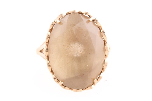 Lot 210 - A single stone smokey quartz dress ring, in...