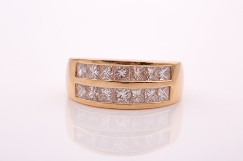 Lot 70 - A yellow metal and diamond ring, the band...