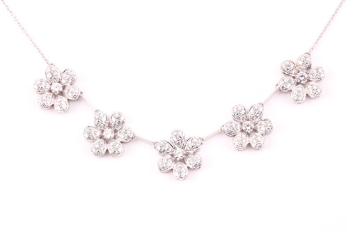 Lot 200 - An 18ct white gold and diamond daisy cluster...