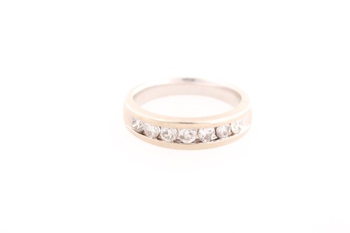 Lot 248 - A seven stone half hoop diamond ring, the...