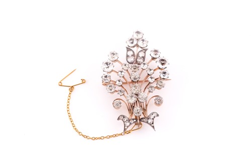 Lot 59 - A silver gilt and paste stone double arrow...