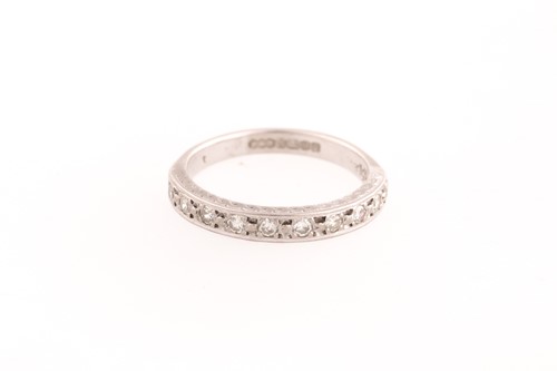 Lot 105 - An 18ct white gold and diamond half eternity...