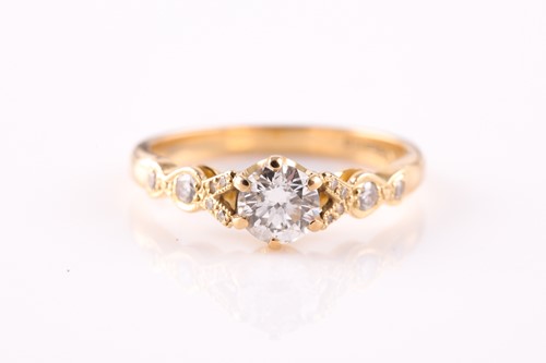 Lot 115 - An 18ct yellow gold and diamond ring, set with...