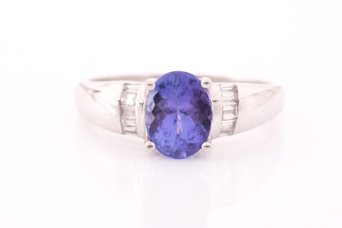 Lot 111 - An 18 ct white gold tanzinite and diamond ring,...