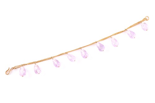 Lot 202 - A nine stone amythest set bracelet, the pear...