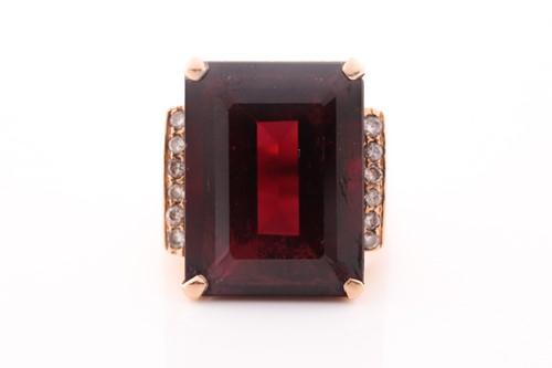 Lot 127 - A yellow metal, diamond, and garnet ring, set...