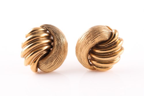 Lot 26 - A pair of yellow metal earrings, of stylised...