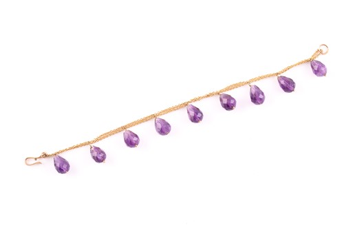 Lot 246 - A yellow metal and amethyst bracelet, the...