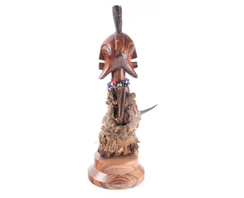 Lot 173 - A Songye Janus power figure, Nkisi, Democratic...