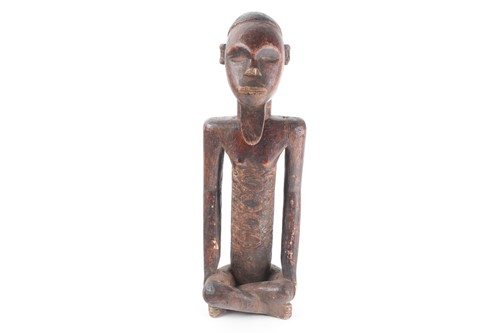 Lot 157 - A Bembe seated male figure, Democratic...