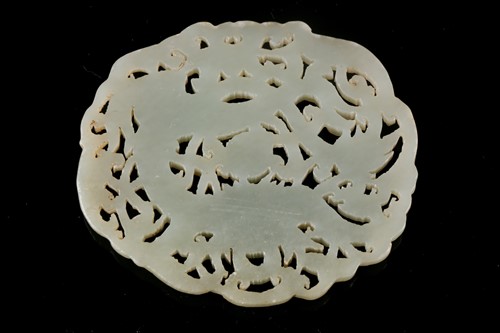 Lot 126 - A Chinese celadon fade pendant, 20th century,...