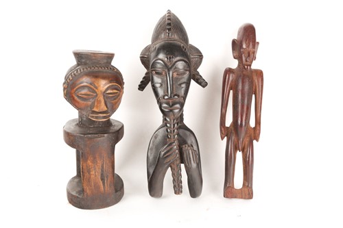 Lot 192 - A Baule heddle pulley, Ivory Coast, carved as...