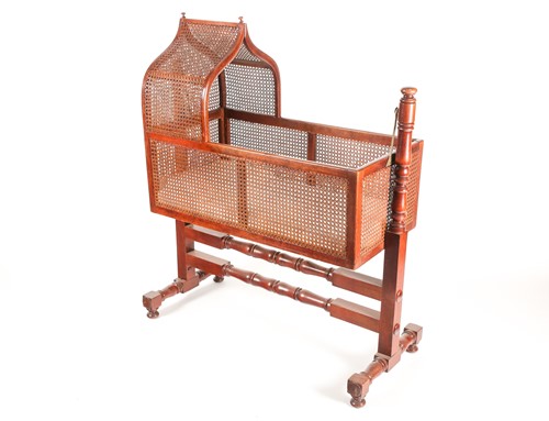 Lot 333 - A mahogany and bergere rocking cradle, circa...
