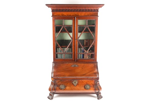 Lot 261 - A Chippendale style miniature mahogany bombe...