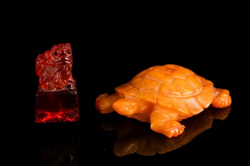 Lot 147 - A Chinese carved butterscotch / yellow amber...
