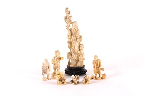 Lot 144 - A Japanese netsuke, early 20th century, carved...