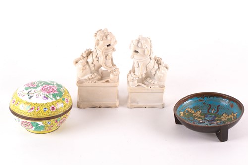 Lot 136 - Two Chinese blanc de chine Buddhist lions,...