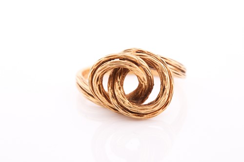 Lot 228 - An 18ct yellow gold ring, of unusual knotted...