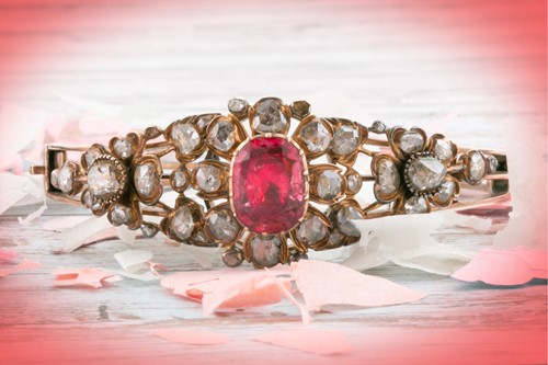 Lot 72 - An antique yellow metal and diamond bangle,...