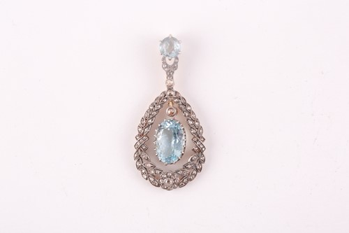 Lot 14 - A diamond and aquamarine pendant, set with a...