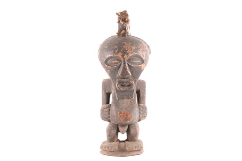 Lot 179 - A Songye standing male power figure, Nkisi,...