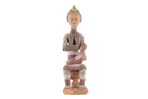 Lot 181 - An Igbo attributed beaded maternity seated...