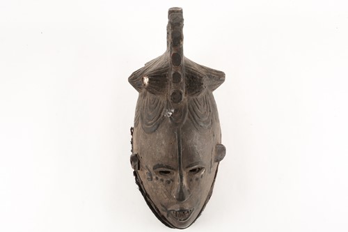 Lot 185 - An Igbo Maiden Spirit mask, Agbogho Mmua,...