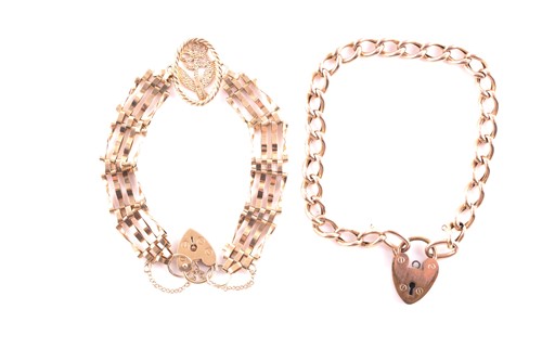 Lot 246 - A 9ct yellow gold gate-link bracelet set with...