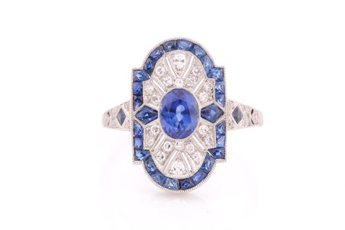 Lot 174 - A platinum, diamond, and sapphire plaque ring,...