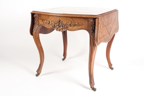 Lot 308 - A Louis XV style two flap low rosewood table...