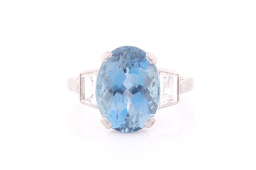 Lot 114 - A diamond and blue topaz ring, set with a...